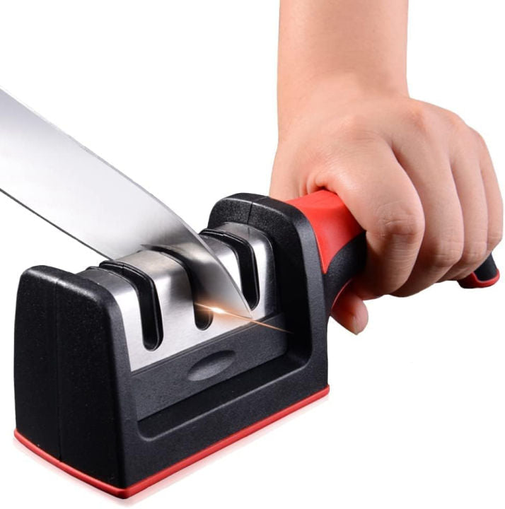 4-in-1 knife sharpener in use — hand pulling a kitchen knife through the sharpening slot for a razor-sharp edge