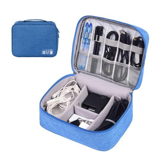 Travel cable organizer pouch interior view with padded dividers holding chargers and adapters