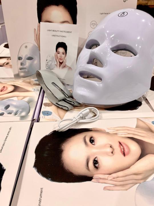 LED face mask on product boxes with USB charging cable