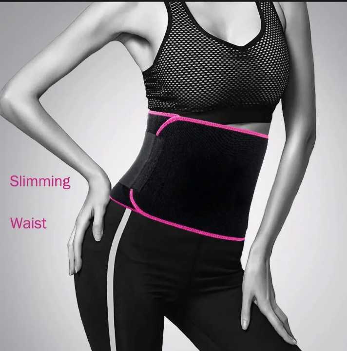 Woman wearing black waist trimmer belt with pink trim during workout