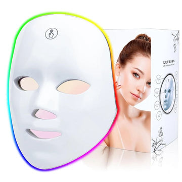 Close-up of the white 7-colour LED photon face mask with multicolour glow, shown with its gift box
