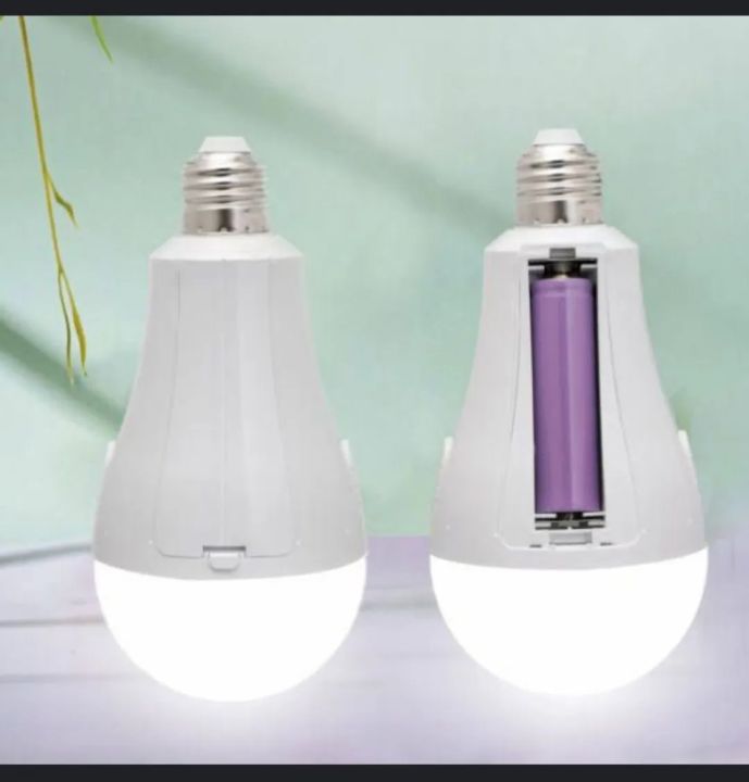 Rechargeable LED emergency bulb with battery compartment open showing the replaceable rechargeable cell, E27 screw base
